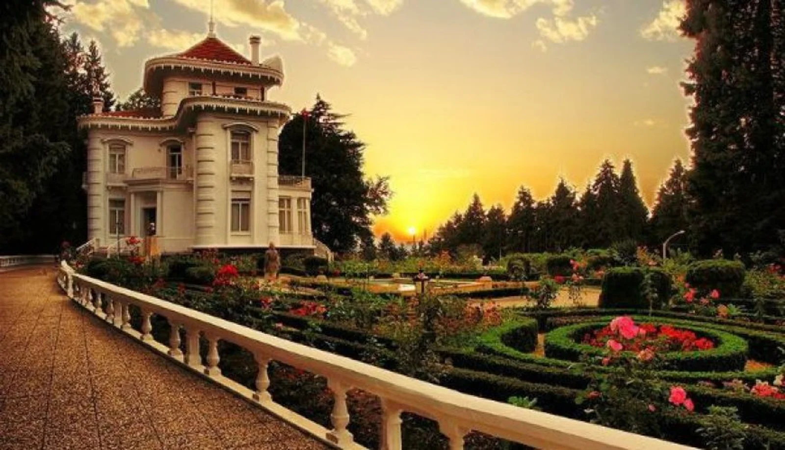 Front facade of the elegant Atatürk Mansion surrounded by gardens